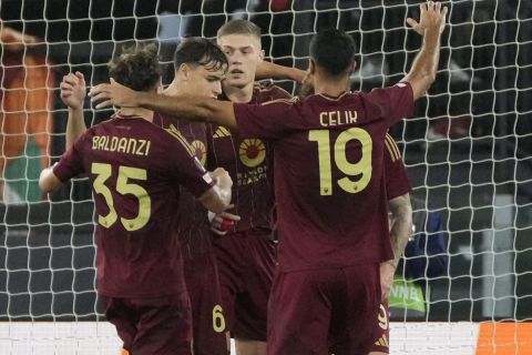 Roma's Artem Dovbyk celebrates with teammates after scoring his side's first goal during the Europa League opening phase soccer match between Roma and Dinamo Kyiv at the Olympic Stadium, in Rome, Thursday, Oct. 24, 2024. (AP Photo/Gregorio Borgia)