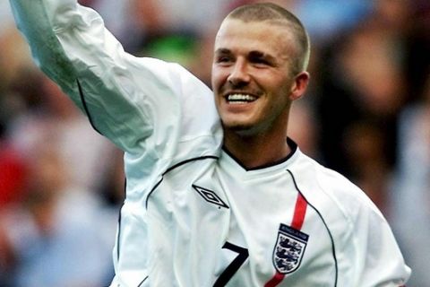 A file picture dated 06 October 2001 of England's David Beckham celebrating after scoring an injury-time equaliser against Greece during the World Cup qualifying match at Old Trafford in Manchester. Real Madrid have reached an agreement to sign English captain David Beckham in what the club sees as the "transfer of the century", Madrid radio station Cadena SER said Tuesday 17 June 2003 . It said the deal was seen as more important than Real's signing, in successive summers, of Luis Figo, Zinedine Zidane and a fee of 25 million euros had been agreed with Beckham's club Manchester United. Earlier reports had said the deal was worth 22 million pounds, or around 30 million euros.  EPA P