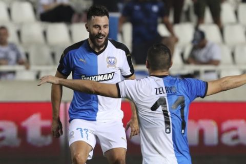 Apollon's Adrian Sardinero celebrates his goal with his teammate Emilio Zelaya during the Europa League second leg second qualifying round soccer match between Apollon Limassol and Shamrock Rovers at GSP stadium, in Nicosia, Cyprus, on Thursday, Aug. 1, 2019. (AP Photo/Petros Karadjias)