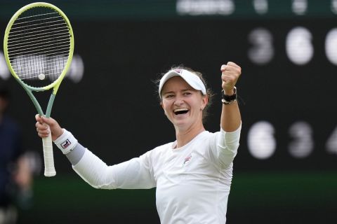 Barbora Krejcikova of the Czech Republic celebrates after defeating Elena Rybakina of Kazakhstan in their semifinal match at the Wimbledon tennis championships in London, Thursday, July 11, 2024. (AP Photo/Mosa'ab Elshamy)