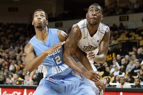 UCF forward Keith Clanton (33) and Rhode Island forward Orion Outerbridge (12) battle for space during the UCF Holiday Classic Men's Basketball Championship Game at UCF Arena in Orlando, FL on December 30, 2011. UCF defeated Rhode Island 65-54. (Kurt Rivers/KnightNews.com)

