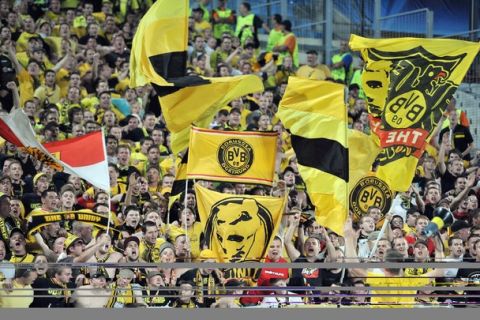 Dortmund's fans cheer their team up before the UEFA Champions league first leg group F football match Olympique de Marseille vs Borussia Dortmund at the Vdrome stadium in Marseille, southern France on September 28, 2011. AFP PHOTO/GERARD JULIEN (Photo credit should read GERARD JULIEN/AFP/Getty Images)