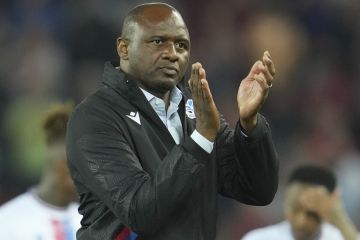 Crystal Palace's head coach Patrick Vieira applauds fans at the end of the English Premier League soccer match between Liverpool and Crystal Palace at Anfield stadium in Liverpool, England, Monday, Aug. 15, 2022. (AP Photo/Jon Super)