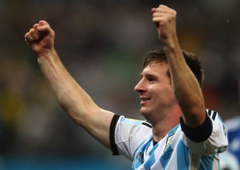 SAO PAULO, BRAZIL - JULY 09:  Lionel Messi of Argentina celebrates defeating the Netherlands in a shootout during the 2014 FIFA World Cup Brazil Semi Final match between the Netherlands and Argentina at Arena de Sao Paulo on July 9, 2014 in Sao Paulo, Brazil.  (Photo by Clive Rose/Getty Images)