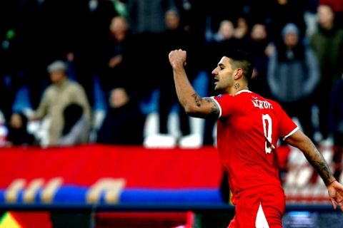 Serbia's Aleksandar Mitrovic celebrates after scoring his side's second goal during the UEFA Nations League soccer match between Serbia and Montenegro at Rajko Mitic stadium in Belgrade, Serbia, Saturday Nov. 17, 2018. (AP Photo/Darko Vojinovic)