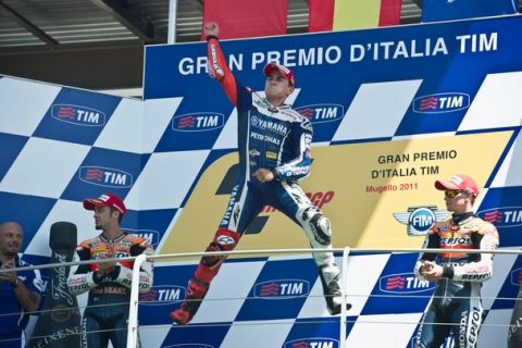 SCARPERIA, ITALY - JULY 03:  Jorge Lorenzo of Spain and Yamaha  Factory Team celebrates victory on the podium, after the MotoGP of Italy at Mugello Circuit on July 3, 2011 in Scarperia near Florence, Italy.  (Photo by Mirco Lazzari gp/Getty Images)