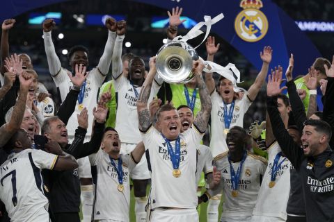 Real Madrid's Toni Kroos lifts the trophy after winning the Champions League final soccer match between Borussia Dortmund and Real Madrid at Wembley stadium in London, Sunday, June 2, 2024. Real Madrid won 2-0. (AP Photo/Frank Augstein)