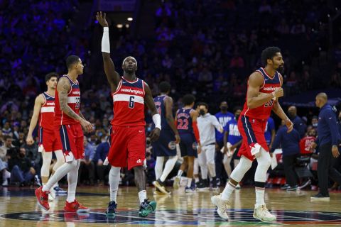 Washington Wizards' Montrezl Harrell, center, waves goodbye to the fans after making the basket during the second half of an NBA basketball game against the Philadelphia 76ers, Wednesday, Feb. 2, 2022, in Philadelphia. The Wizards won 106-103. (AP Photo/Chris Szagola)