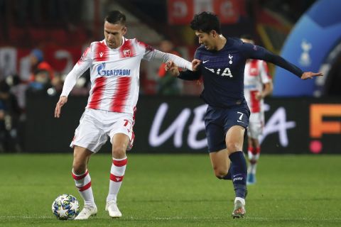 Tottenham's Son Heung-min, right, challenges for the ball with Red Star's Marko Gobeljic during the Champions League group B soccer match between Red Star and Tottenham, at the Rajko Mitic Stadium in Belgrade, Serbia, Wednesday, Nov. 6, 2019. (AP Photo/Darko Vojinovic)