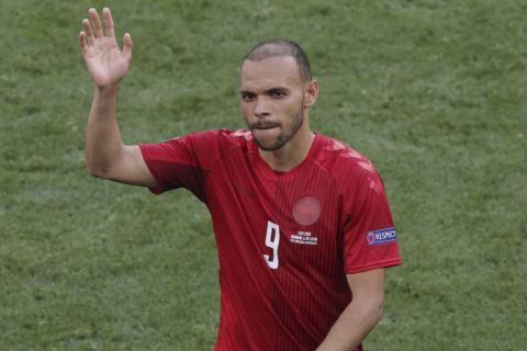 Denmark's Martin Braithwaite greets supporters after the Euro 2020 soccer championship group B match between Denmark and Belgium at the Parken stadium in Copenhagen, Denmark, Thursday, June 17, 2021. (Hannah McKay/Pool via AP)