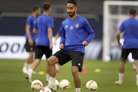 FC Basel's Samuele Campo plays the ball during a training session in Gelsenkirchen, Germany, Monday, Aug. 10, 2020. FC Basel will play Shakhtar Donetsk in a Europa League quarterfinal soccer match on Tuesday. (Lars Baron/Pool Photo via AP)