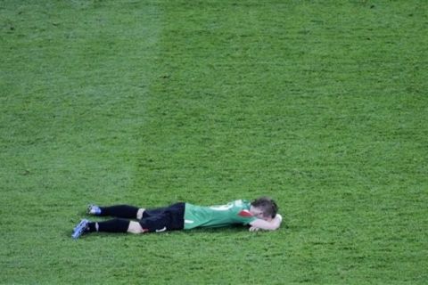 Athletic Bilbao's Muniain reacts at the end of the Europa League final soccer match at the National Arena in Bucharest, Romania Wednesday May 9, 2012. Atletico Madrid won 3 - 0.  (AP Photo/Darko Vojinovic)