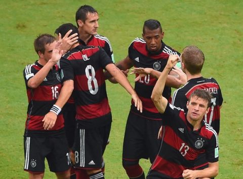 RECIFE, BRAZIL - JUNE 26:  Thomas Mueller of Germany (R) celebrates scoring his team's first goal with teammates during the 2014 FIFA World Cup Brazil group G match between the United States and Germany at Arena Pernambuco on June 26, 2014 in Recife, Brazil.  (Photo by Laurence Griffiths/Getty Images)