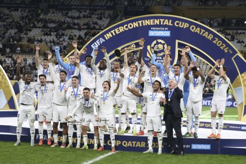 Real Madrid's players celebrate with the trophy after winning the Intercontinental Cup soccer final match against CF Pachuca at the Lusail Stadium in Lusail, Qatar, Wednesday, Dec. 18, 2024. Real Madrid won the game 3-0.(AP Photo/Hussein Sayed)