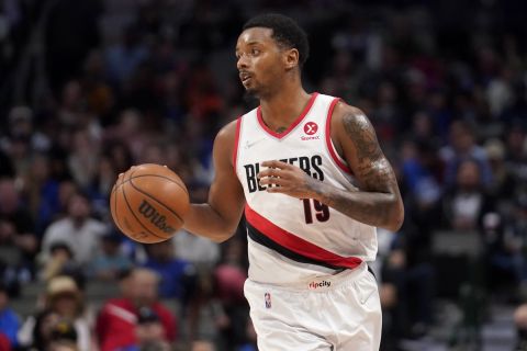 Portland Trail Blazers forward Elijah Hughes handles the ball during an NBA basketball game against the Dallas Mavericks, Friday, April 8, 2022, in Dallas. (AP Photo/Tony Gutierrez)