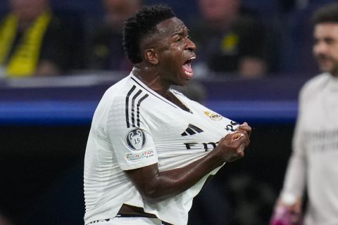 Real Madrid's Vinicius Junior celebrates after scoring his side's second goal during the Champions League opening phase soccer match between Real Madrid and Borussia Dortmund at the Santiago Bernabeu stadium in Madrid, Tuesday, Oct. 22, 2024. (AP Photo/Manu Fernandez)