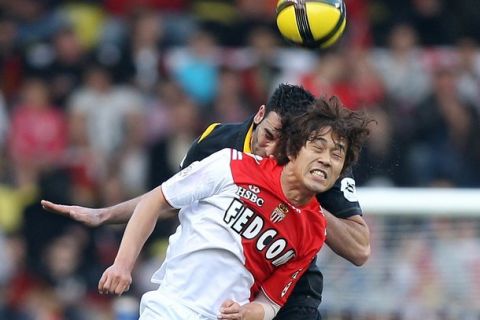 Monaco's forward Chu Young Park (R) vies with Lille's defender Adil Rami (L) during the French L1 football match Monaco vs Lille, on April 09, 2011 at the Louis II stadium in Monaco.  AFP PHOTO VALERY HACHE (Photo credit should read VALERY HACHE/AFP/Getty Images)