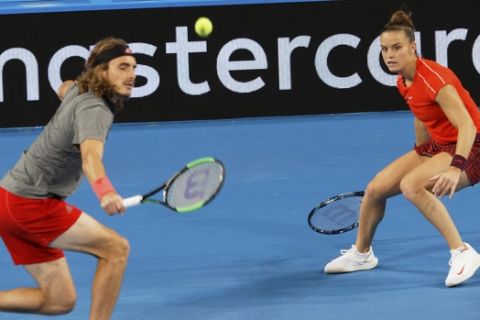 Stefanos Tsitsipas and Maria Sakkari of Greece during their mixed doubles match against Switzerland's Roger Federer and Belinda Bencic at the Hopman Cup in Perth, Australia, Thursday Jan. 3, 2019. (AP Photo/Trevor Collens)