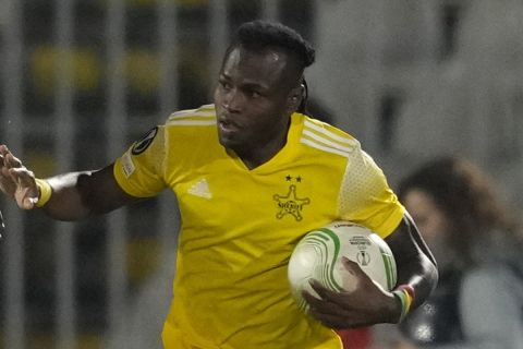 Sheriff's Cedric Badolo, right, celebrates with his teammate Rasheed Akanbi after scoring his side's opening goal during the Europa Conference League playoff second leg soccer match between Partizan and Sheriff, at the Partizan stadium in Belgrade, Serbia, Thursday, Feb. 23, 2023. (AP Photo/Darko Vojinovic)