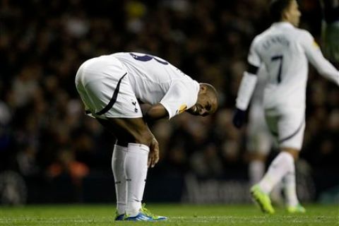 Tottenham's Jermain Defoe reacts in pain during the Europa League Group A soccer match between Tottenham and PAOK at White Hart Lane stadium in London, Wednesday, Nov. 30, 2011.  (AP Photo/Matt Dunham)