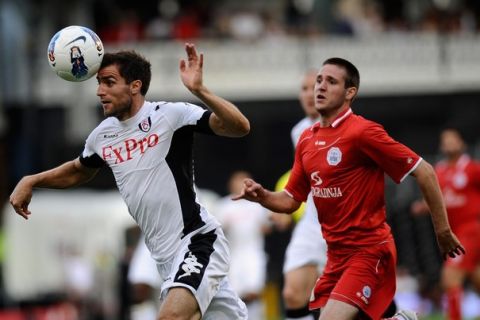 LONDON, ENGLAND - AUGUST 04:  Aaron Hughes of Fulham heads the ball away during the UEFA Europa League 3rd Qualifying Round 2nd Leg match between Fulham and RNK Split at Craven Cottage on August 4, 2011 in London, England.  (Photo by Alan Crowhurst/Getty Images)