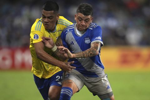 Joao Grimaldo of Peru's Sporting Cristal, left, and Diego Garcia of Ecuador's Emelec, battle for the ball during a Copa Sudamericana second leg play-off soccer match at George Capwell stadium in Guayaquil, Ecuador, Wednesday, July 19, 2023. (AP Photo/Dolores Ochoa)