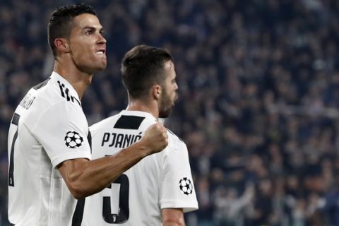 Juventus forward Cristiano Ronaldo celebrates after scoring his side's opening goal during the Champions League group H soccer match between Juventus and Manchester United at the Allianz stadium in Turin, Italy, Wednesday, Nov. 7, 2018. (AP Photo/Antonio Calanni)