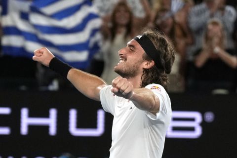 Stefanos Tsitsipas of Greece celebrates after defeating Jannik Sinner of Italy during their fourth round match at the Australian Open tennis championship in Melbourne, Australia, Sunday, Jan. 22, 2023. (AP Photo/Ng Han Guan)