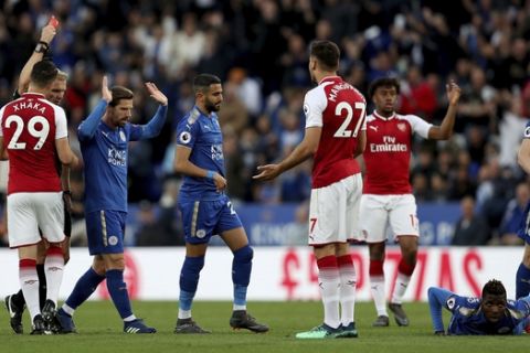 Arsenal's Konstantinos Mavropanos, no. 27, is sent off by match referee Graham Scott during the English Premier League soccer match against Leicester City at the King Power Stadium, Leicester, England, Wednesday May 9, 2018. (David Davies/PA via AP)