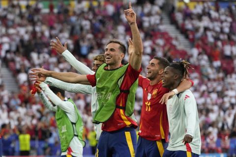 Spain players celebrate after a quarterfinal match between Germany and Spain at the Euro 2024 soccer tournament in Stuttgart, Germany, Friday, July 5, 2024. (AP Photo/Antonio Calanni)