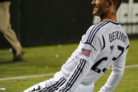 Los Angeles Galaxy midfielder David Beckham (23) celebrates after scoring a goal against the Portland Timbers in the second half of an MLS soccer game in Carson, Calif., Saturday, April 14, 2012. The Galaxy won 3-1.(AP Photo/Lori Shepler)