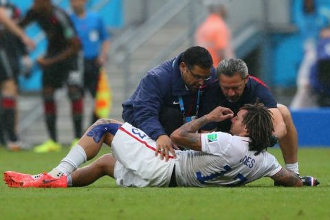 RECIFE, BRAZIL - JUNE 26: Jermaine Jones of the United States receives treatment after a collision during the 2014 FIFA World Cup Brazil group G match between the United States and Germany at Arena Pernambuco on June 26, 2014 in Recife, Brazil.  (Photo by Kevin C. Cox/Getty Images)