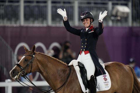 Britain's Charlotte Dujardin, riding Gio, waves after competing in the equestrian dressage individual final at the 2020 Summer Olympics, Wednesday, July 28, 2021, in Tokyo. (AP Photo/David Goldman)