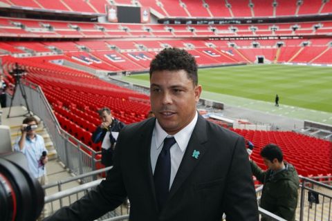 Former Brazilian footballer Ronaldo poses for photographers during a photocall at the draw for the London 2012 Olympic football tournament at Wembley Stadium in London, on April 24, 2012. Host nation Great Britain will kick off the Olympic football tournament against Senegal at Manchester United's Old Trafford ground on July 26 following the draw made at Wembley. AFP PHOTO / JUSTIN TALLIS (Photo credit should read JUSTIN TALLIS/AFP/Getty Images)