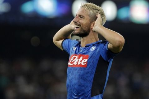 Napoli's Dries Mertens celebrates after scoring the opening goal of his team during the Champions League Group E soccer match between Napoli and Liverpool, at the San Paolo stadium in Naples, Italy, Tuesday, Sept. 17, 2019. (AP Photo/Gregorio Borgia)