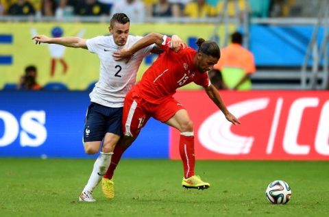 SALVADOR, BRAZIL - JUNE 20:  Ricardo Rodriguez of Switzerland fights off Mathieu Debuchy of France during the 2014 FIFA World Cup Brazil Group E match between Switzerland and France at Arena Fonte Nova on June 20, 2014 in Salvador, Brazil.  (Photo by Christopher Lee/Getty Images)