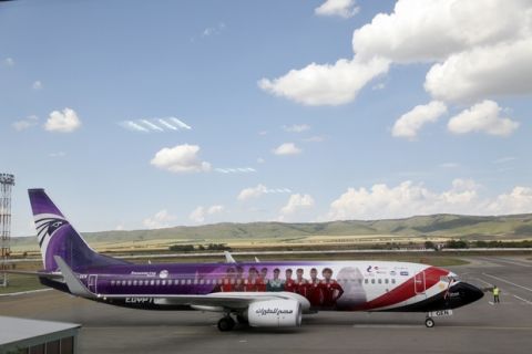 A plane with the Egypt national soccer team lands at an airport outside Grozny, Russia, Sunday, June 10, 2018 to compete in the 2018 World Cup in Russia. The 21st World Cup begins on Thursday, June 14, 2018, when host Russia takes on Saudi Arabia. (AP Photo/Musa Sadulayev)