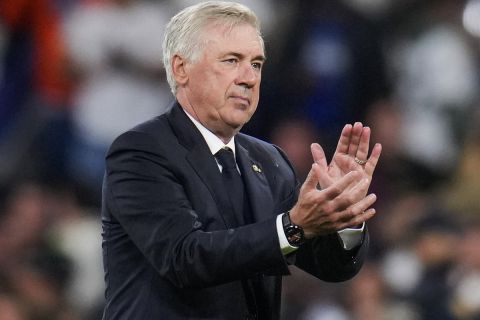 Real Madrid's head coach Carlo Ancelotti applauds to supporters at the end of the Champions League opening phase soccer match between Real Madrid and Borussia Dortmund at the Santiago Bernabeu stadium in Madrid, Tuesday, Oct. 22, 2024. Real Madrid won 5-2. (AP Photo/Manu Fernandez)