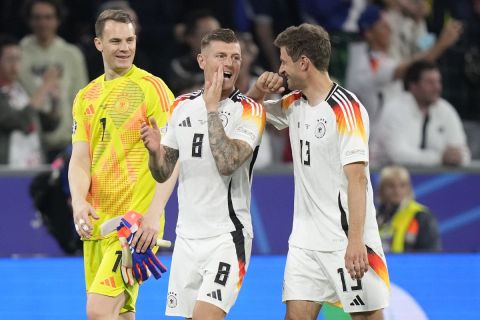 Germany's goalkeeper Manuel Neuer, Toni Kroos and Thomas Mueller, from left, react after a Group A match between Germany and Scotland at the Euro 2024 soccer tournament in Munich, Germany, Friday, June 14, 2024. Germany won the match 5-1. (AP Photo/Matthias Schrader)