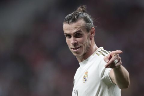 Real Madrid's Gareth Bale gestures during the Spanish La Liga soccer match between Atletico Madrid and Real Madrid at the Wanda Metropolitano stadium in Madrid, Saturday, Sept. 28, 2019. (AP Photo/Bernat Armangue)