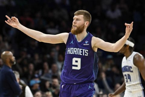 Charlotte Hornets forward Davis Bertans (9) gestures after making a 3-point basket against the Orlando Magic' during the second half of an NBA basketball game Tuesday, March 5, 2024, in Charlotte, N.C. (AP Photo/Matt Kelley)