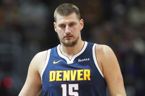 Denver Nuggets center Nikola Jokic (15) in the first half of an NBA bsketball game Wednesday, Nov. 6, 2024, in Denver. (AP Photo/David Zalubowski)