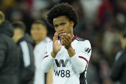 Fulham's Willian applauds at the end of the English Premier League soccer match between Liverpool and Fulham, at Anfield Stadium, Liverpool, England, Wednesday, May 3, 2023. (AP Photo/Jon Super)