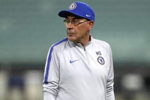 Chelsea head coach Maurizio Sarri directs a soccer training session at the Olympic stadium in Baku, Azerbaijan, Tuesday May 28, 2019. English Premier League teams Arsenal and Chelsea are preparing for the Europa League Final soccer match that takes place in Baku on Wednesday night. (AP Photo/Darko Bandic)