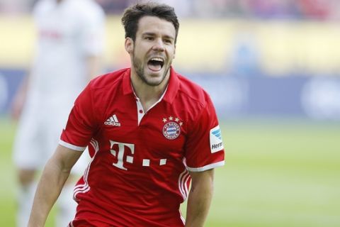 Bayern's Juan Bernat celebrates his side's second goal during a German first division Bundesliga soccer match between 1. FC Cologne and Bayern Munich in Cologne, Germany, Saturday, March 4, 2017. ( AP Photo/Michael Probst)