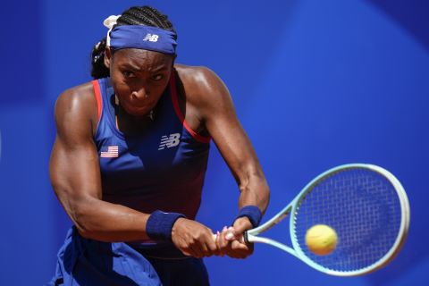 Coco Gauff of United States returns the ball against Maria Lourdes Carle of Argentina during the women's singles tennis competition at the at the Roland Garros stadium, at the 2024 Summer Olympics, Monday, July 29, 2024, in Paris, France. (AP Photo/Manu Fernandez)