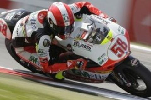 Italy's Marco Simoncelli steers his Gilera during the 250cc free practice in Assen, northern Netherlands, Thursday June 25, 2009.  Simoncelli will be driving MotoGP for the Gresini Honda team next race season and currently ranks fifth overall after six races. (AP Photo/Bas Czerwinski) 