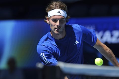 Stefanos Tsitsipas of Greece watches the ball on the net after hitting a return to Alexander Shevchenko of Kazakhstan during their United Cup tennis match in Perth, Australia, Monday, Dec. 30, 2024. (AP Photo/Trevor Collens)