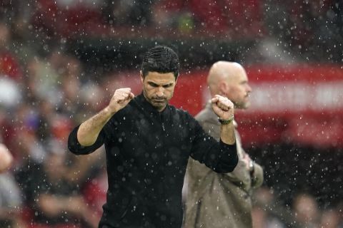 Arsenal's manager Mikel Arteta reacts after winning the English Premier League soccer match between Manchester United and Arsenal at the Old Trafford Stadium in Manchester, England, Sunday, May 12, 2024. Arsenal won 1-0. (AP Photo/Dave Thompson)