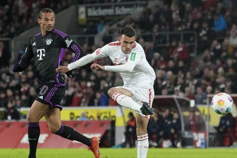 Cologne's Dejan Ljubicic attempts a goal during the German Bundesliga soccer match between 1.FC Cologne and Bayern Munich in Cologne, Germany, Friday, Nov. 24, 2023. (AP Photo/Martin Meissner)